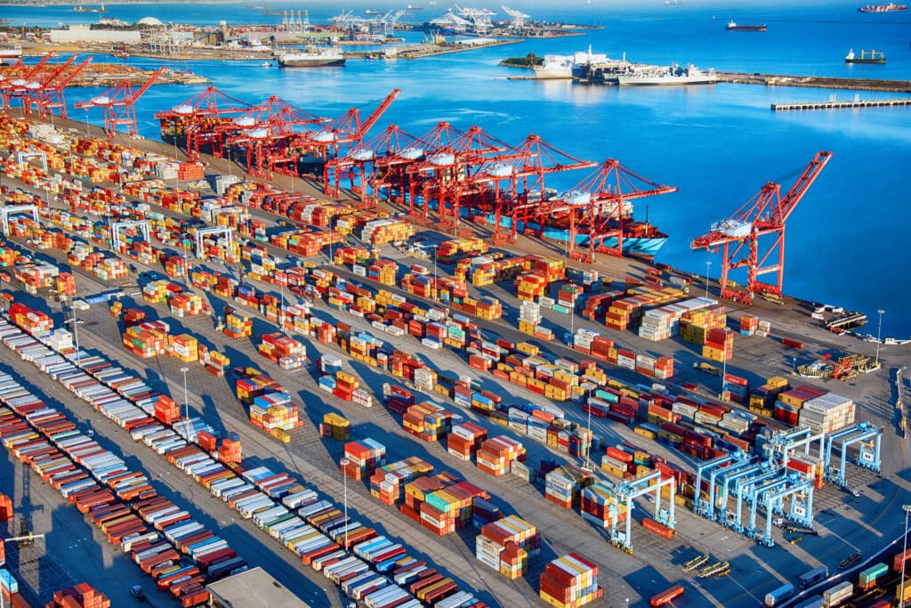 San Pedro, United States - March 28, 2018: Ships, containers, and railways at the Ports of Long Beach and Los Angeles, California; the busiest seaport on the west coast of the United States, shot wide angle from an altitude of about 1500 feet during a helicopter photo flight.